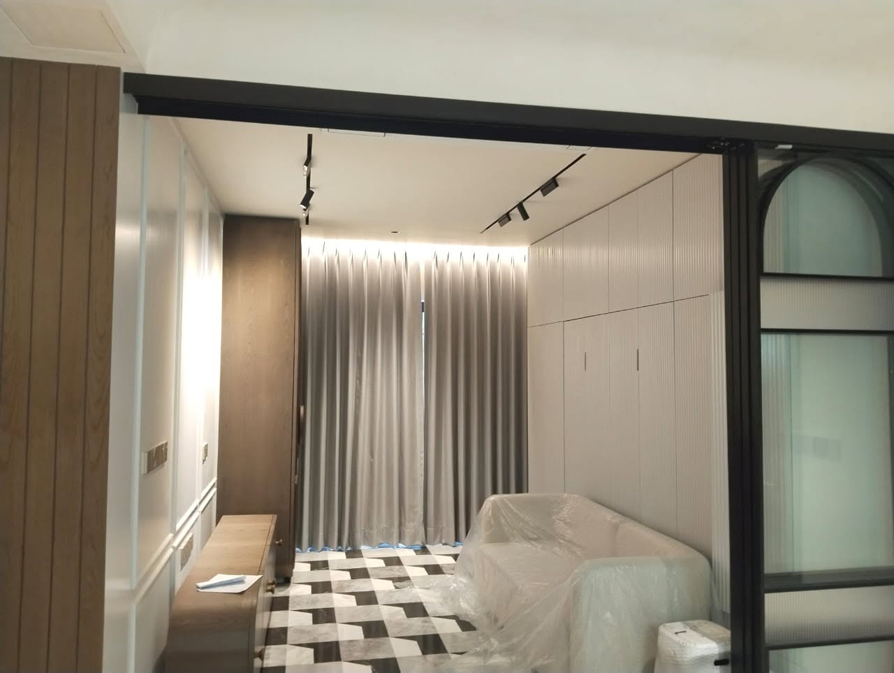 Living room with built-in storage and warm lighting